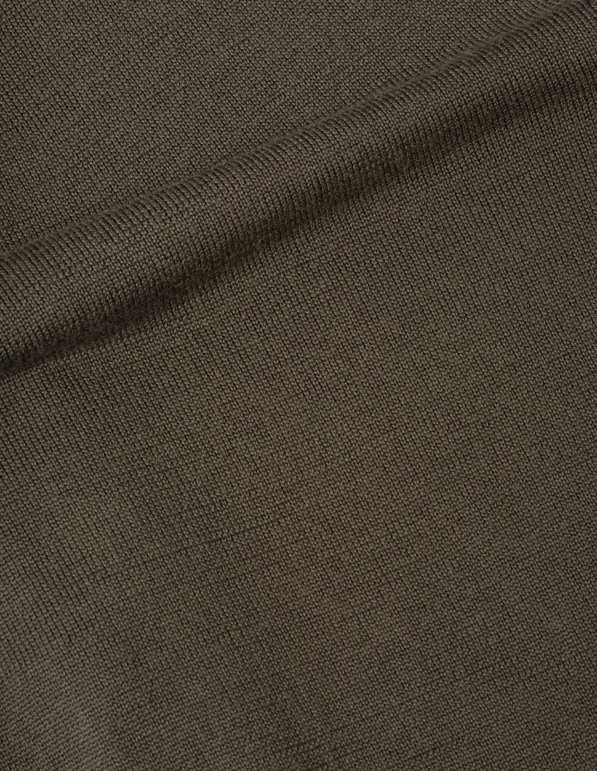 Green japanese spun merino cardigan fabric swatch.