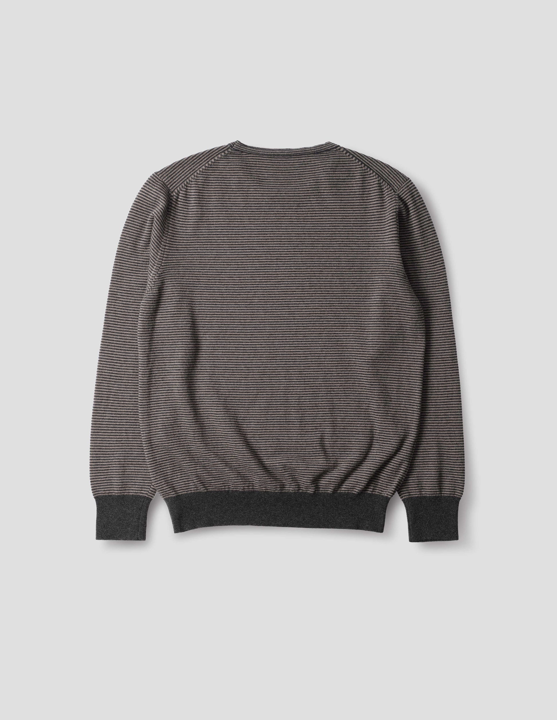Grey merino cashmere jumper with dark grey stripes, crew neck with tubular collar, and with contrast rib on cuffs and hem. Back flat lay view.