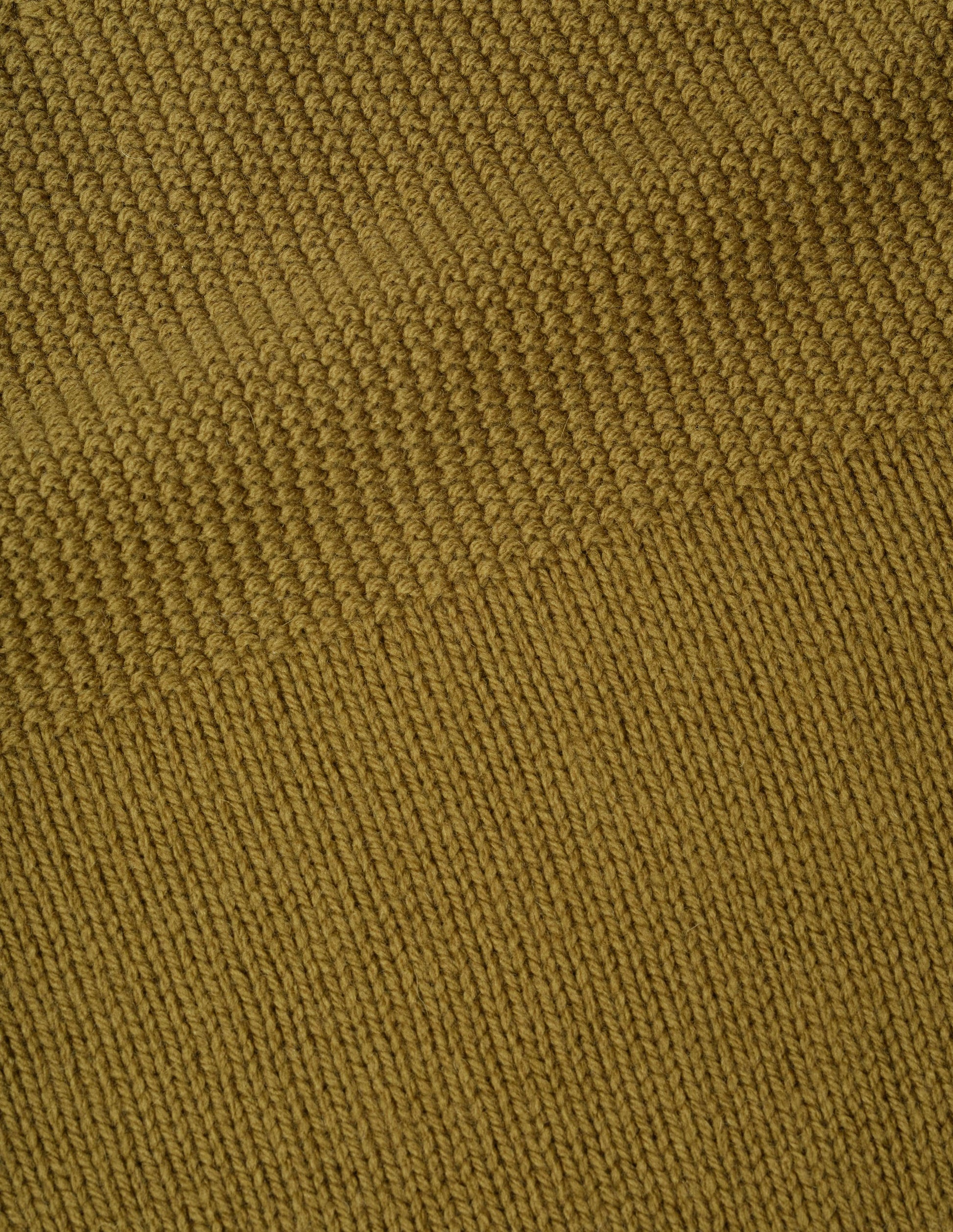 Dark yellow soft wool jumper fabric swatch.