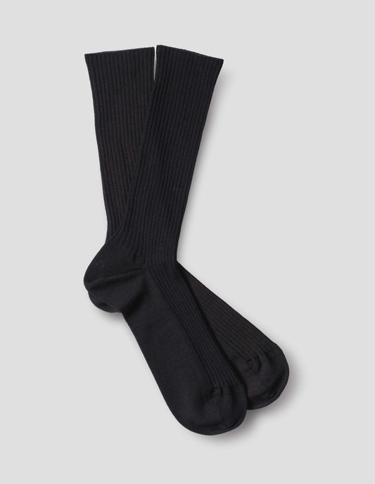 Black wool socks, ribbed, front flat lay view.
