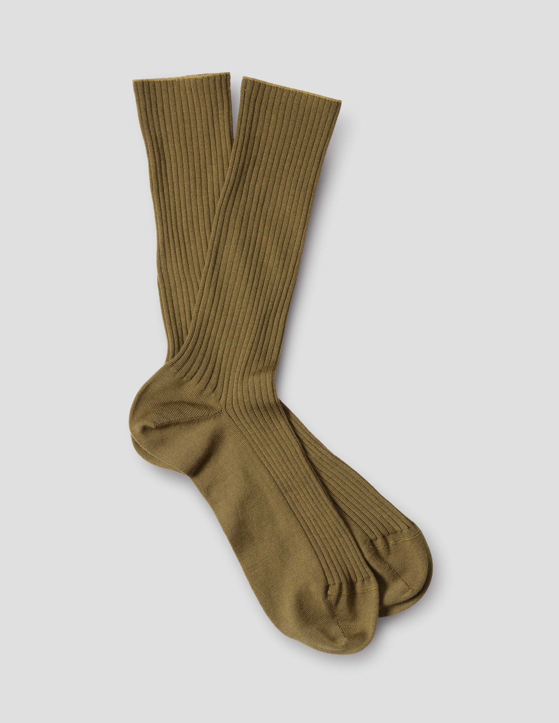 Yellowish green wool socks, ribbed, front flat lay view.