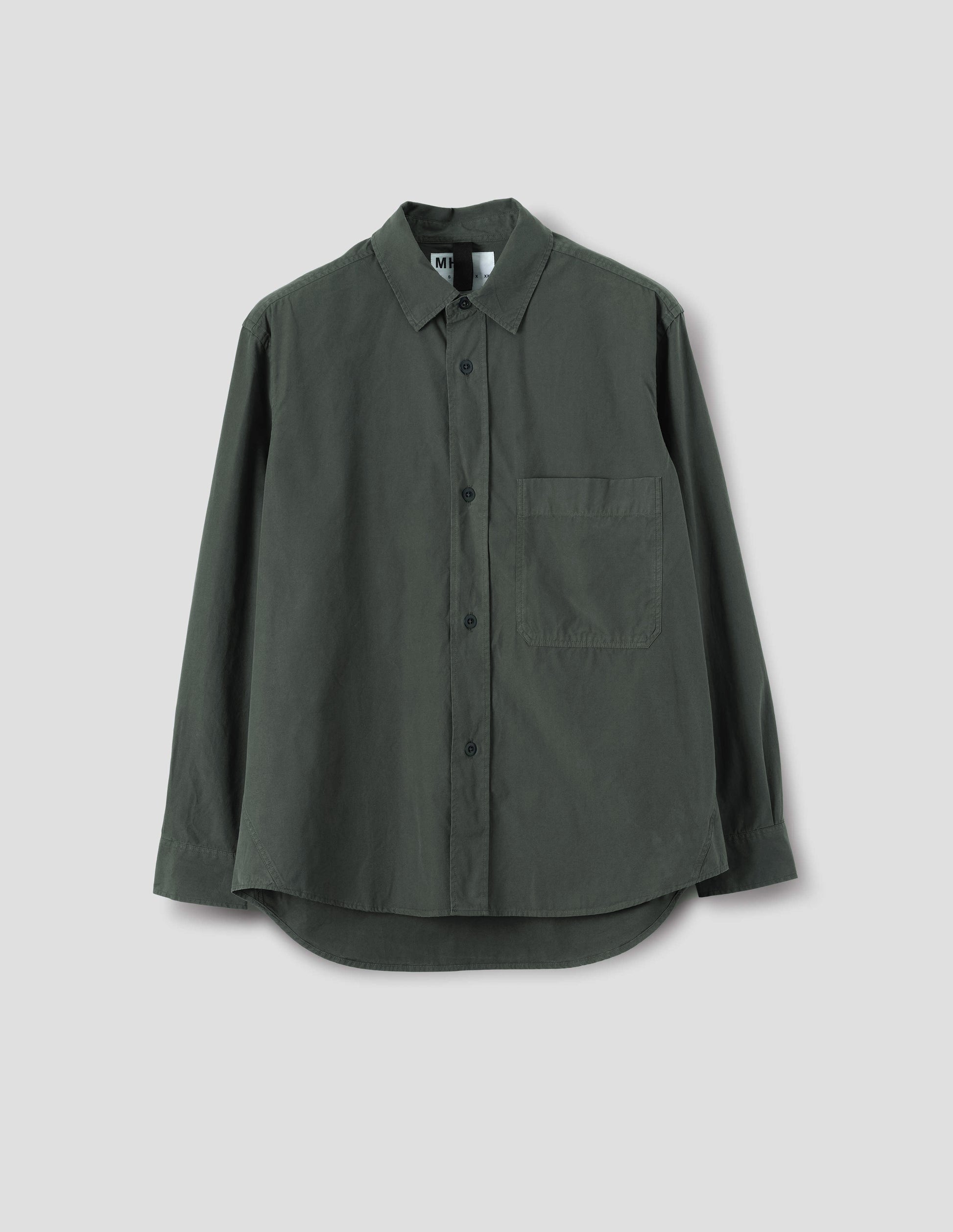 A relaxed dark grey cotton shirt with a raised placket, large chest pocket, side gusset stitch detailing and hanger loop detailing on inside collar. Front flat lay view.
