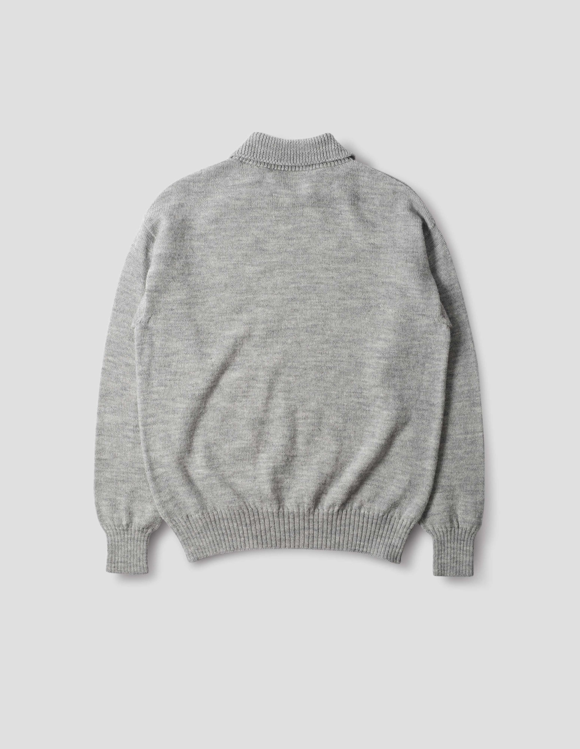 Collared wool sweater in light grey with a wide rib linked on collar, plain knit body, and deeper ribbed cuffs. Finished with a straight hem, back flat view.