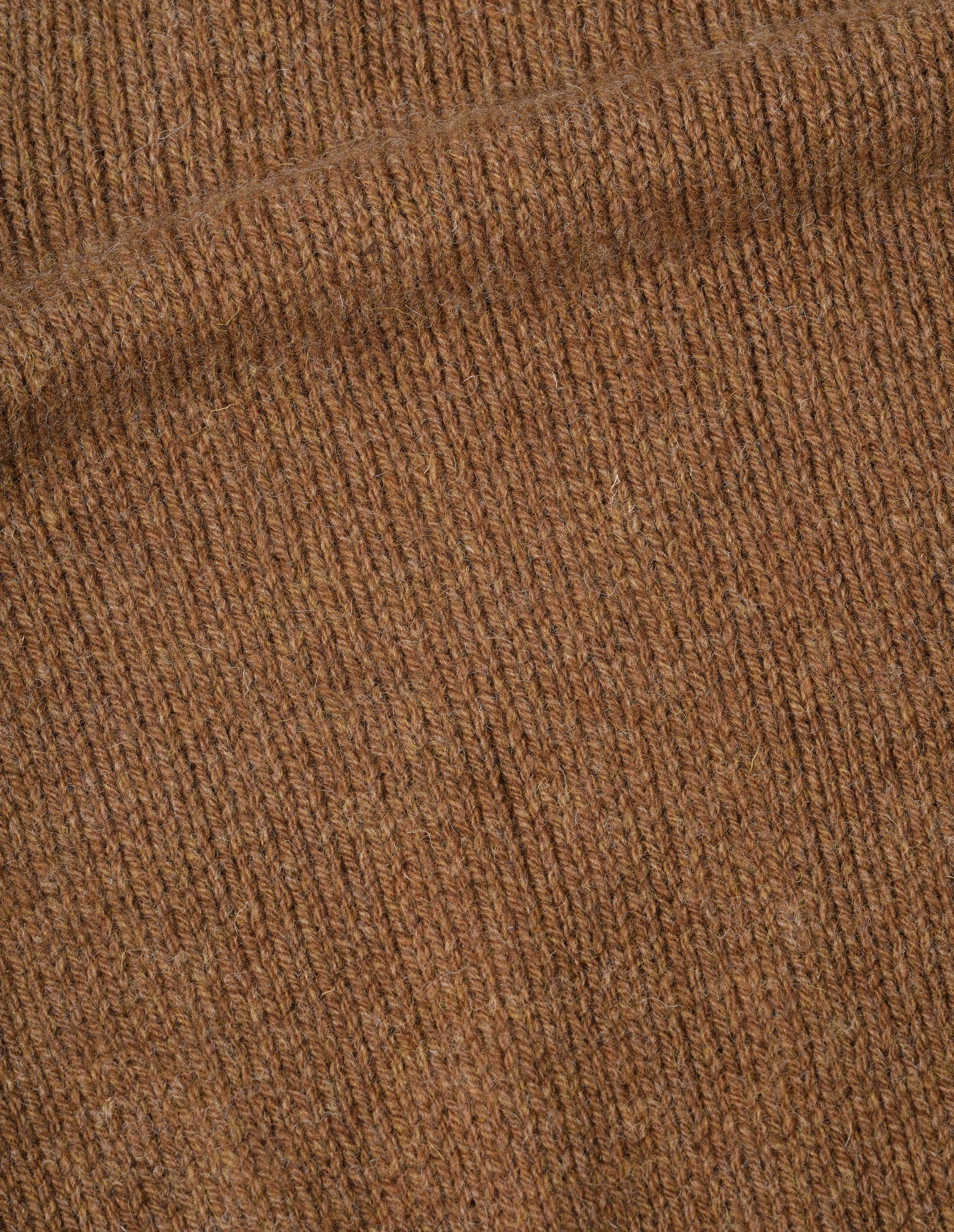 Orangey brown rustic wool jumper, fabric swatch.