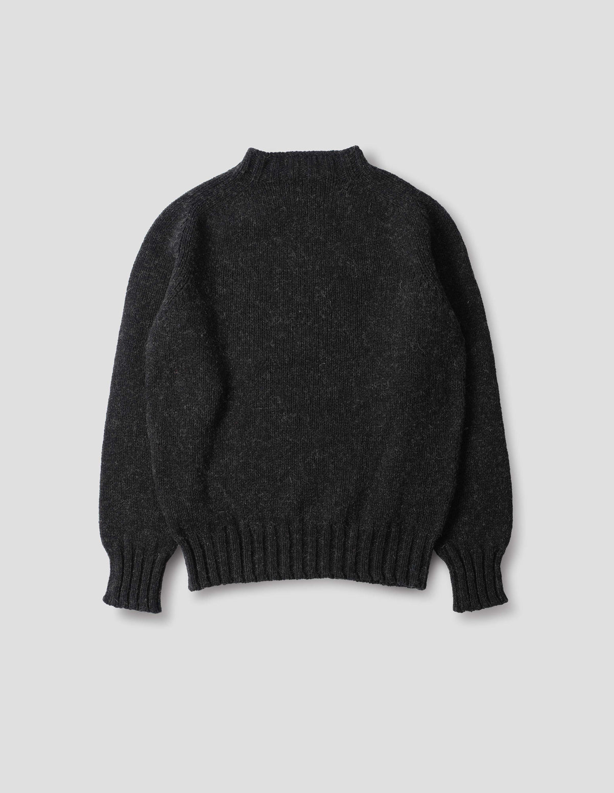 Dark grey long sleeve wool jumper, with contrast ribbing on neckline, cuffs and hem. Back flat lay view.