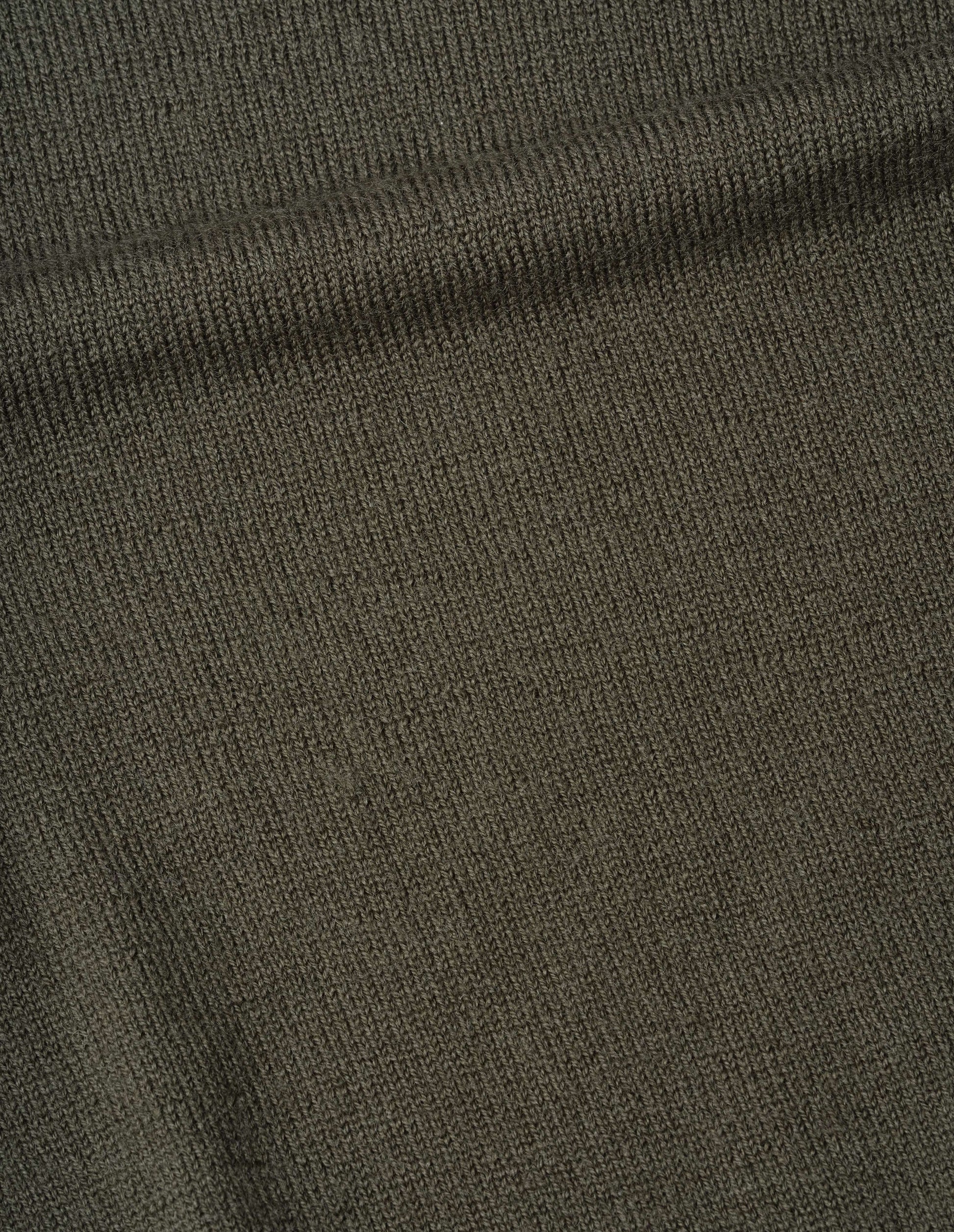 Dark green virgin wool crew neck, fabric swatch.