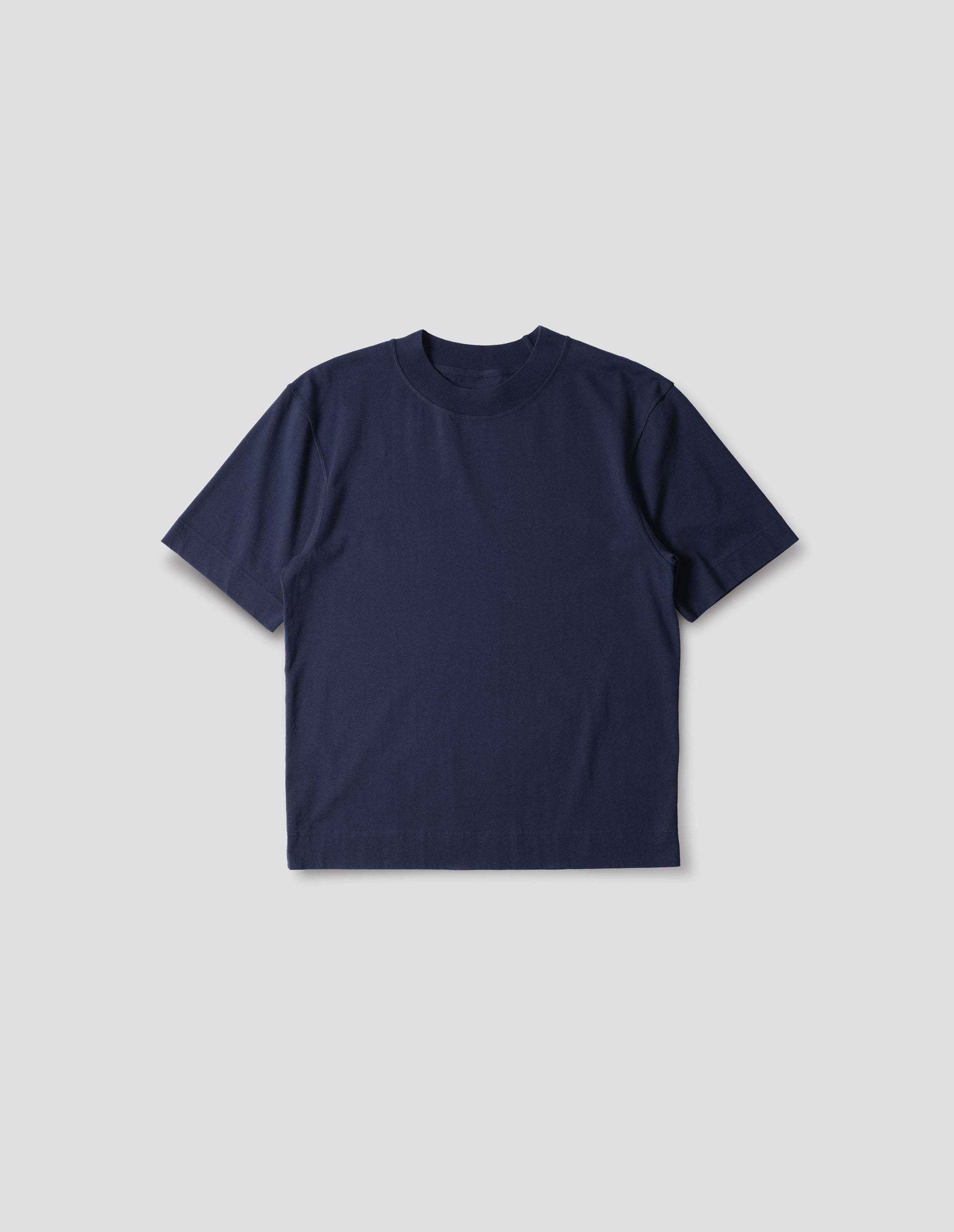 Blue cotton t shirt, with ribbed crew neck and flatlock stitching, front flat lay view.