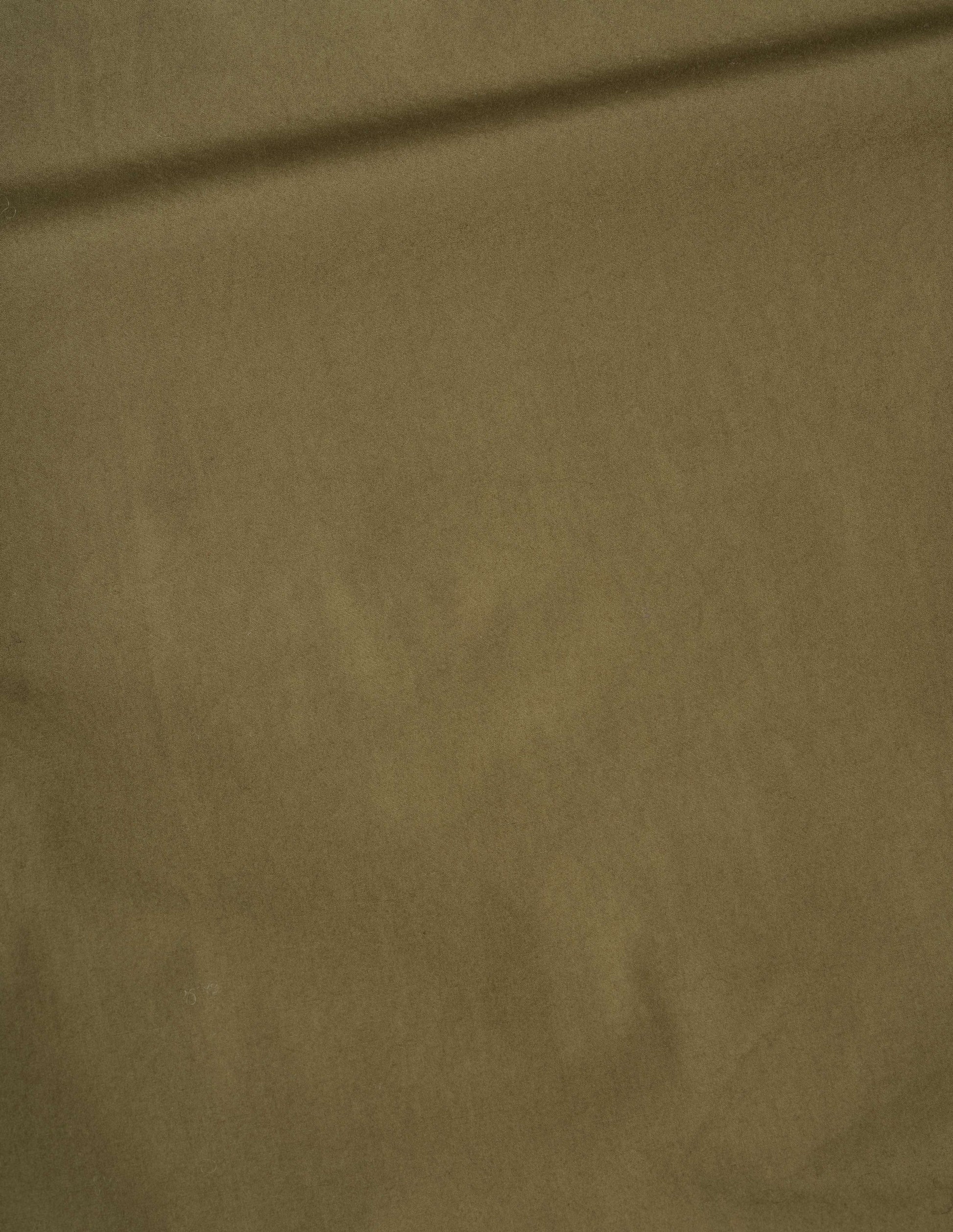 Green compact cotton poplin front yoke shirt, fabric swatch.