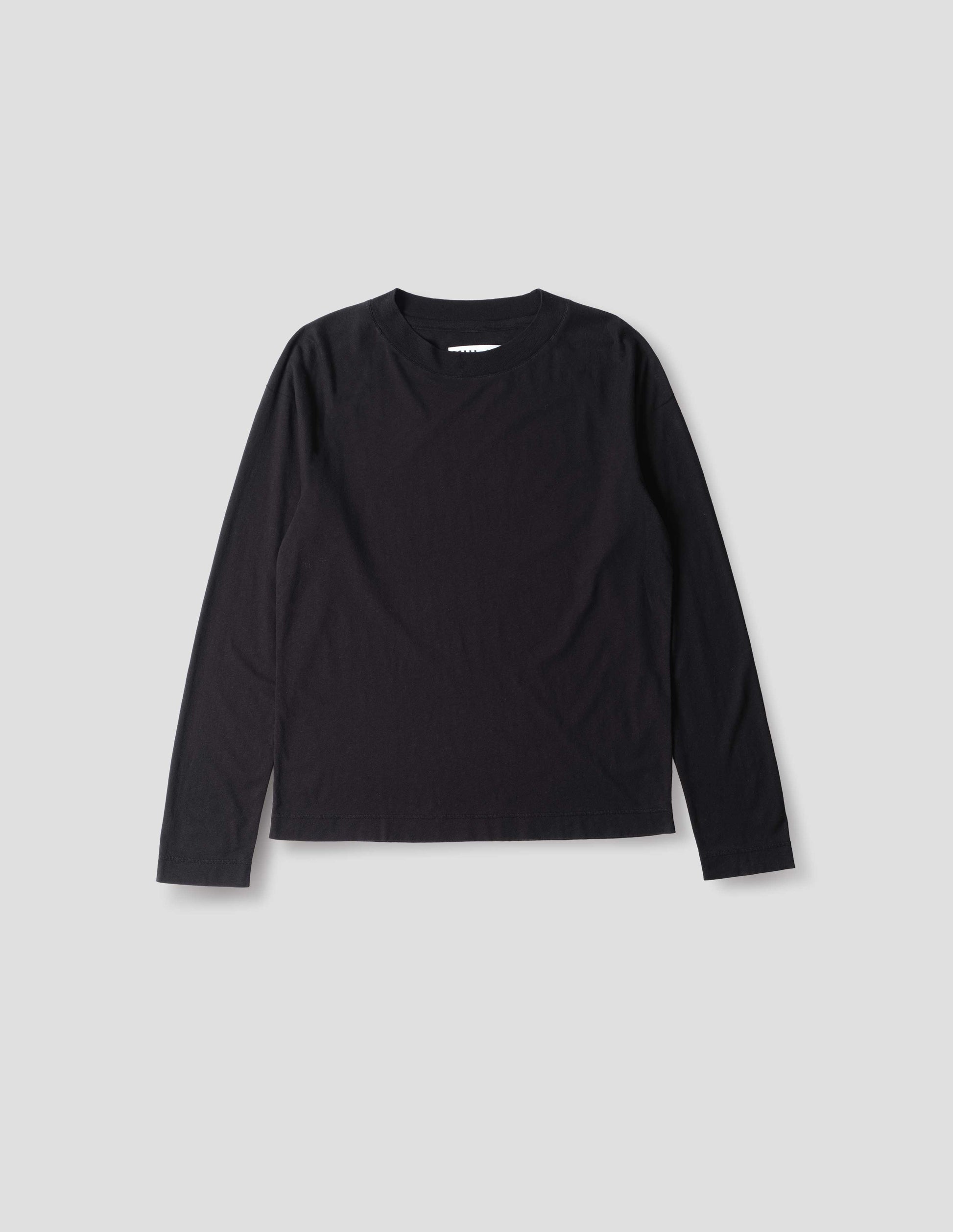 Black cotton linen long sleeve crew neck jersey. Relaxed, boxy cut. front flat lay view.