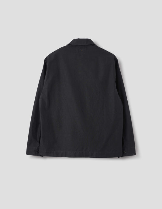 Black denim shirt, with button closure cuffs, split placket, and straight side split hem. Back flat lay view.