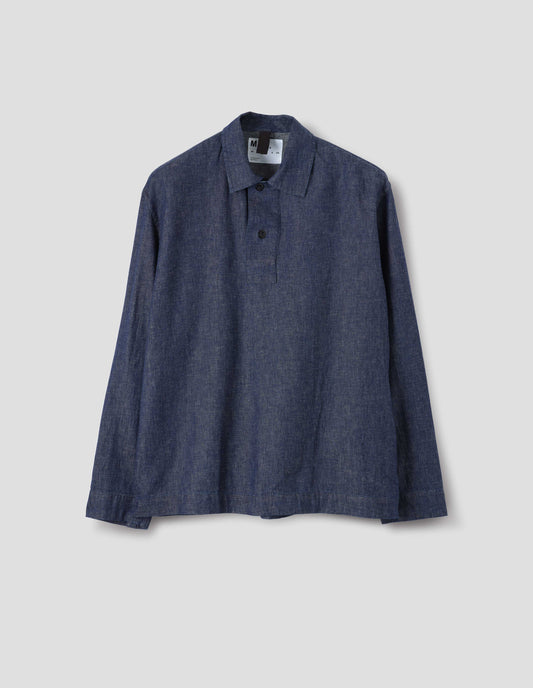 Blue cotton linen shirt, with two dark button at opening, front flat lay view.