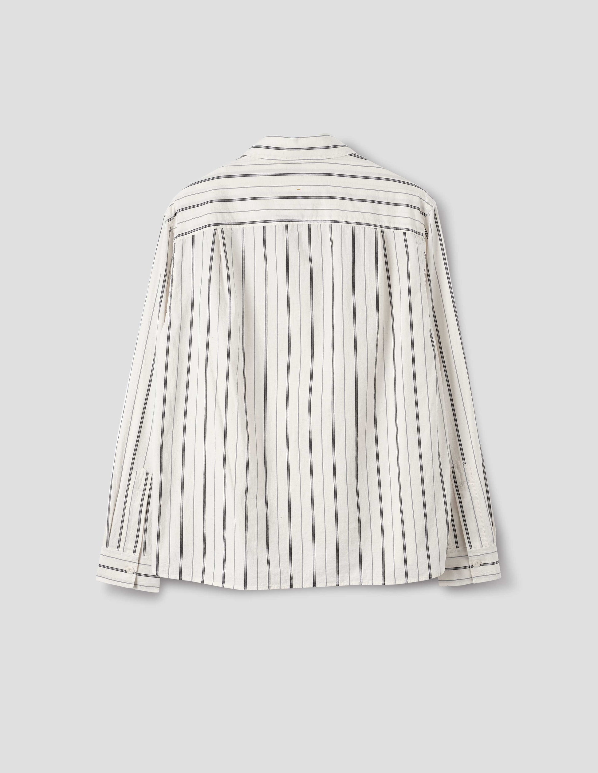 Off white and dark blue stripe cotton shirt, with back yoke and two pleats, back flat lay view.