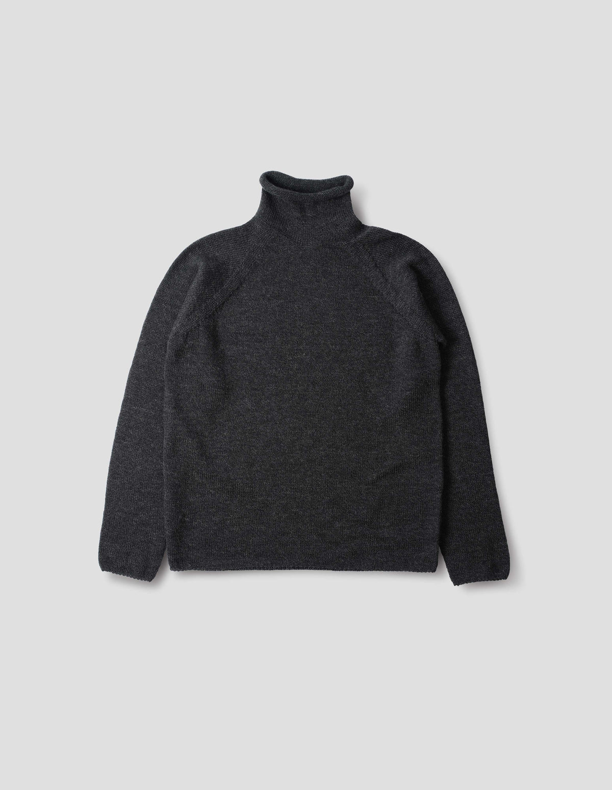 Off black high neck fully fashioned midweight wool sweater with raglan sleeves, rolled cuffs and hem, front flat lay view.