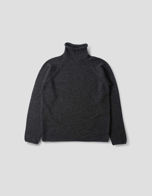 Off black high neck fully fashioned midweight wool sweater with raglan sleeves, rolled cuffs and hem, front flat lay view.