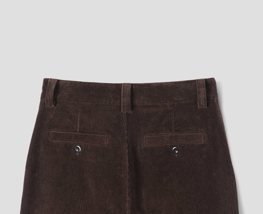 Brown midweight cotton corduroy trousers with belt loops and two back welt pockets with buttons, back flat lay view.