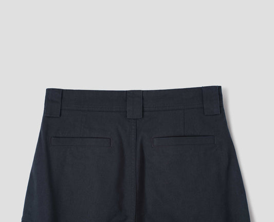 Dark blue cotton trousers, with wide belt loops and two  welt pockets, back flat lay view.