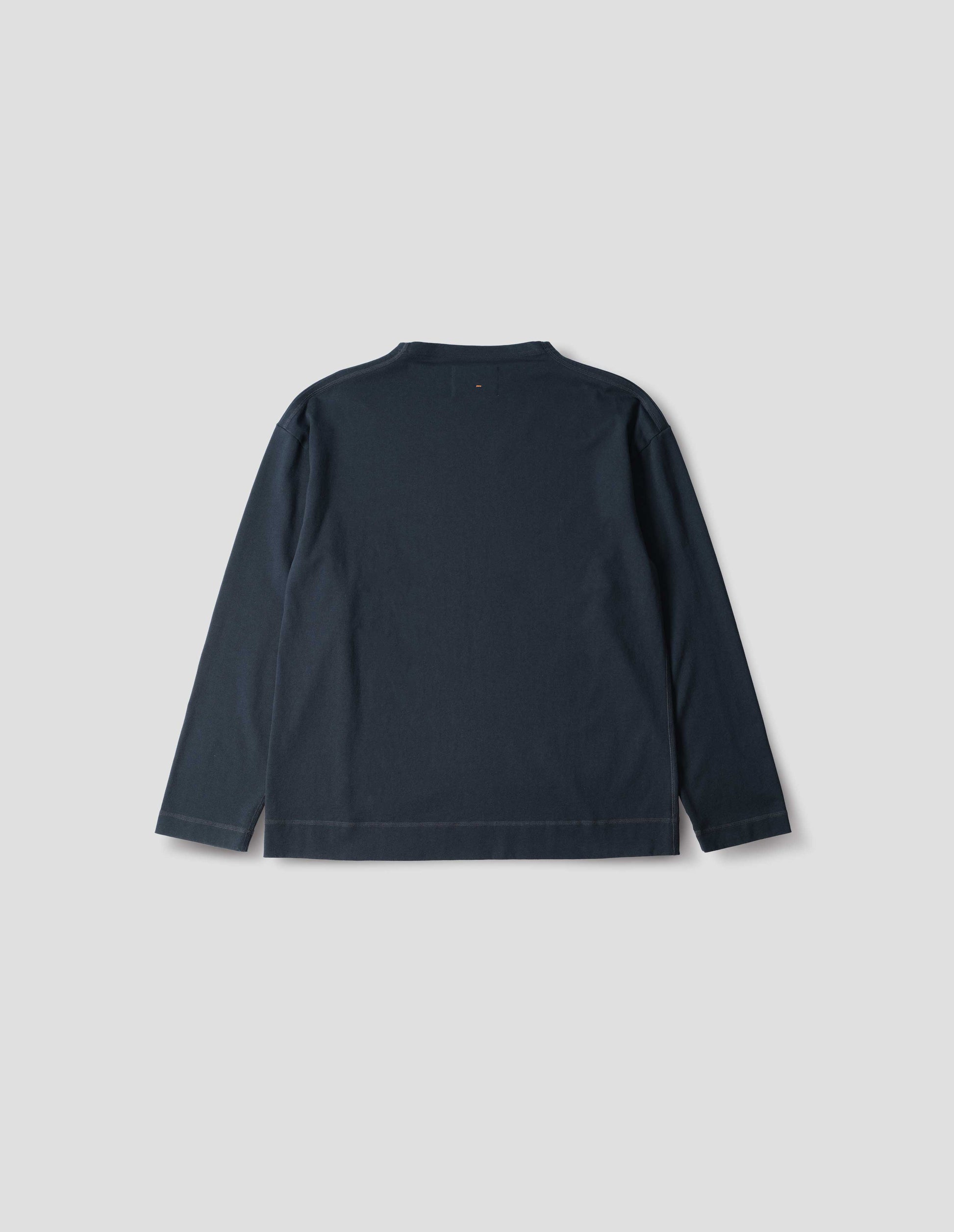 Dark blue cotton t shirt, with long sleeves and flatlock stitching around cuffs and hem, back flat lay view.