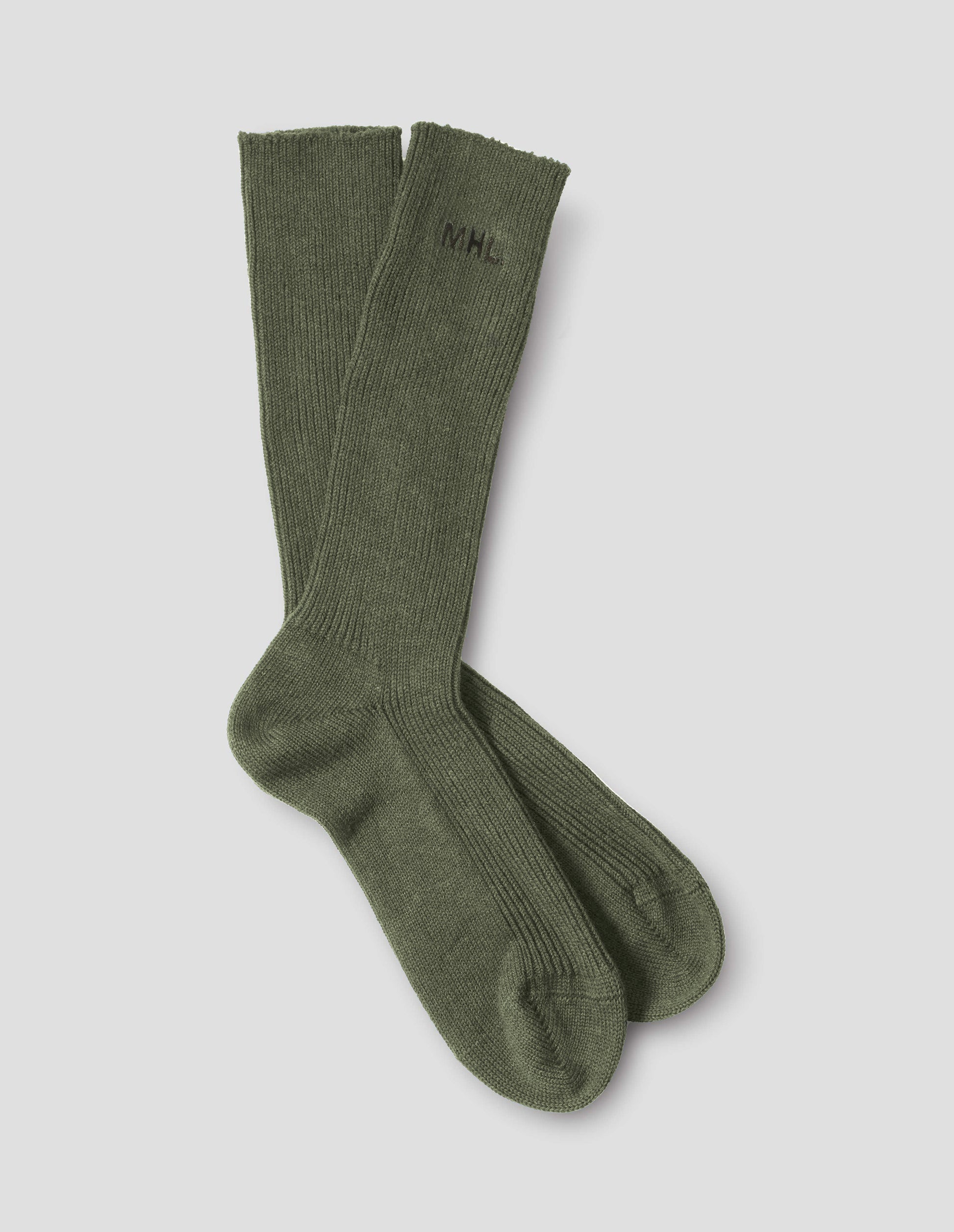 Green cotton socks, with embroidered MHL logo, front flat lay view.