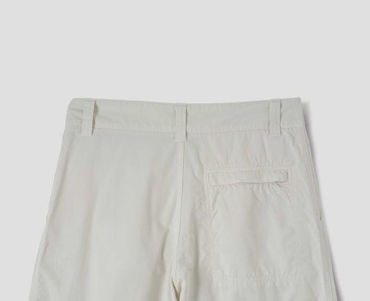Off white cotton trousers, finished with one stitch-through back pocket with a concealed Vislon zip fastening, back flat lay view.