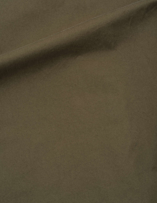 Brownish green cotton pleated trousers, fabric swatch.