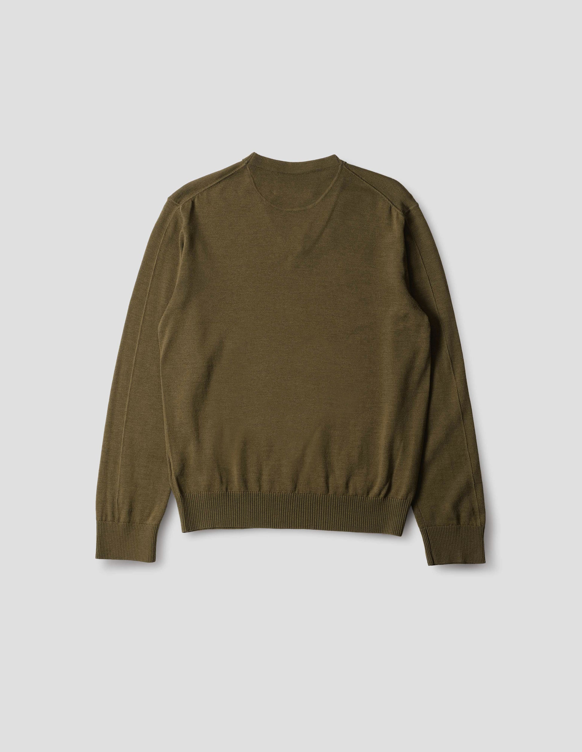 Green brown fine wool jumper, with a half-moon yoke at back neck, flatlock detailing on the sleeves and rib on cuffs and hem, back flat lay view.