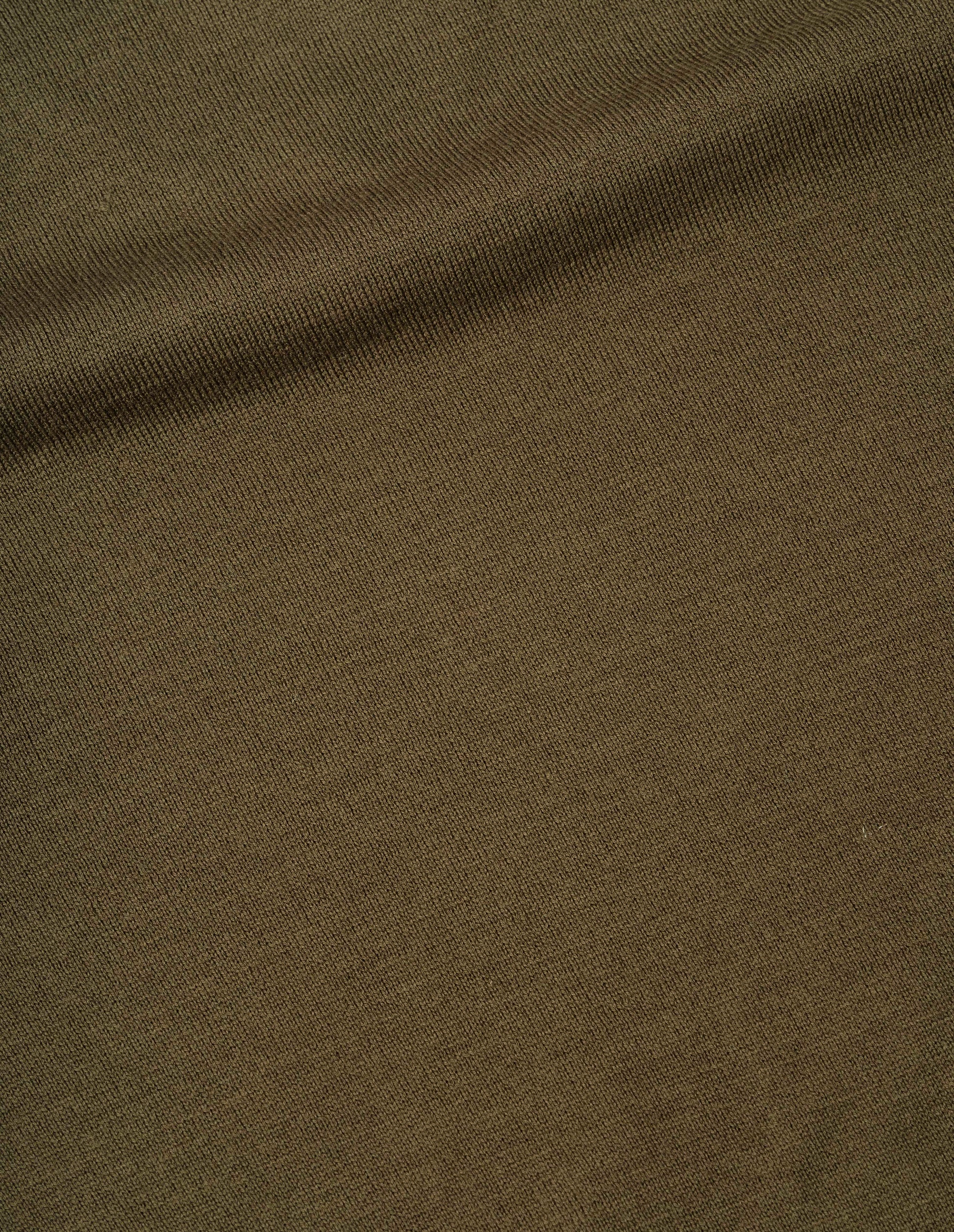 Green brown fine wool jumper, fabric swatch.