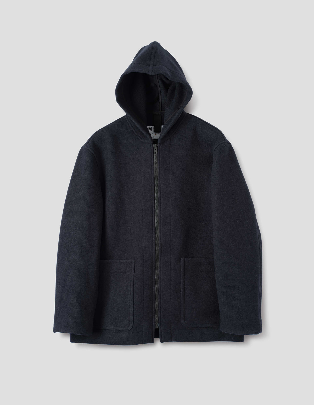 Dark navy zip through wool coat, with a hood, two laid-on patch pockets, straight cuffs and hems. Front flat lay view.
