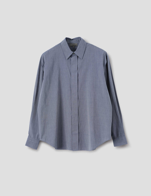 Blue cotton shirt with concealed button placket and mother of pearl button on collar, hanger loop on back neck and curved hem. Front flat lay view.