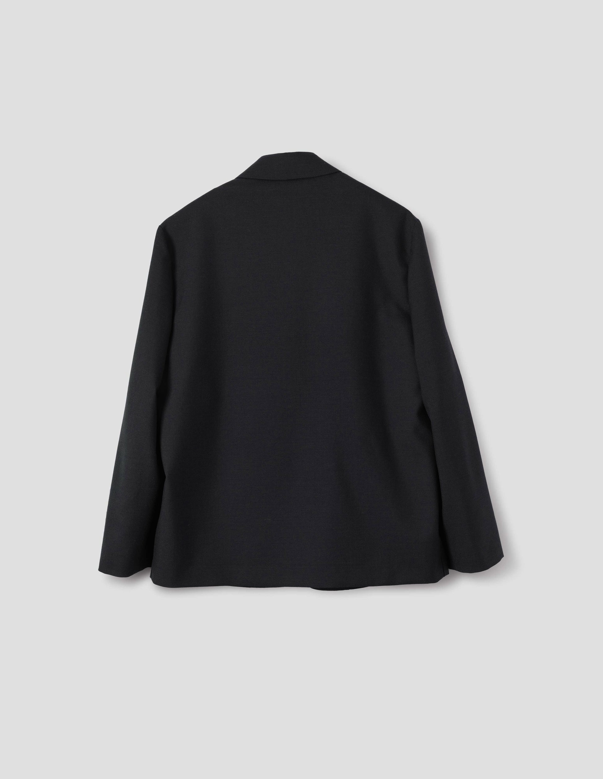 Black wool blazer with dropped shoulders. Back flat lay view.