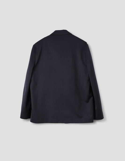 Dark blue wool cotton blazer with dropped shoulders. Back flat lay view.