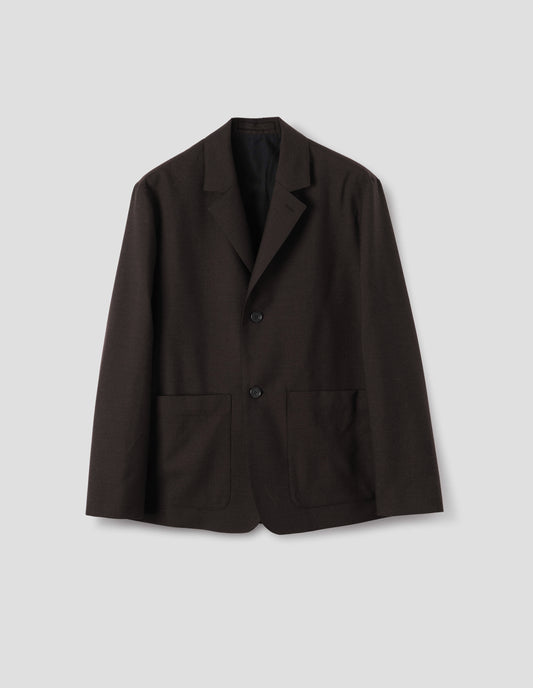 Dark brown wool blazer with dropped shoulders, horn buttons and deep patch pockets. Front flat lay view.