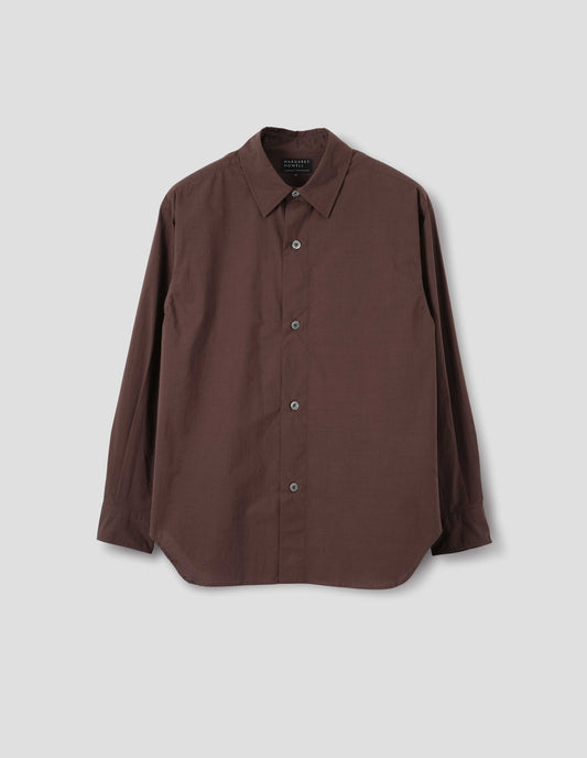 Brown cotton shirt with mother of pearl buttons on wide stitch-through placket and curved hem. Front flat lay view.
