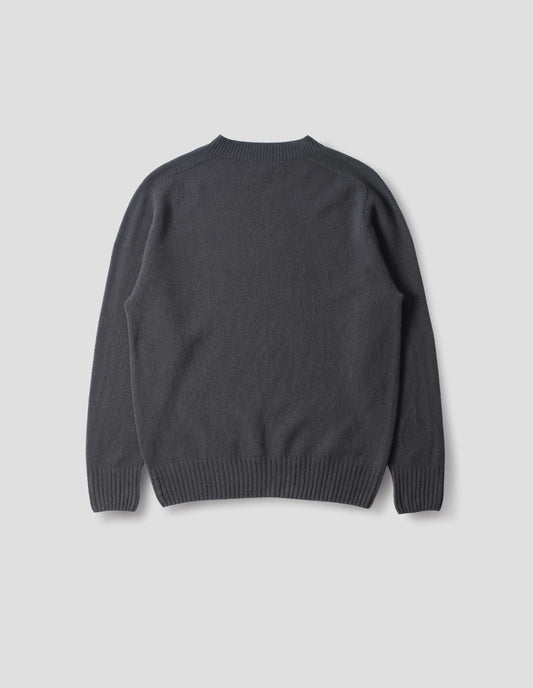 Dark grey merino cashmere seamless jumper with ribbed crew neck, cuffs and hem. Back flat lay view.