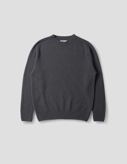 Dark grey merino cashmere seamless jumper with ribbed crew neck, cuffs and hem. Front flat lay view.