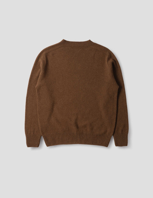 Brown merino cashmere seamless jumper with ribbed crew neck, cuffs and hem. Back flat lay view.
