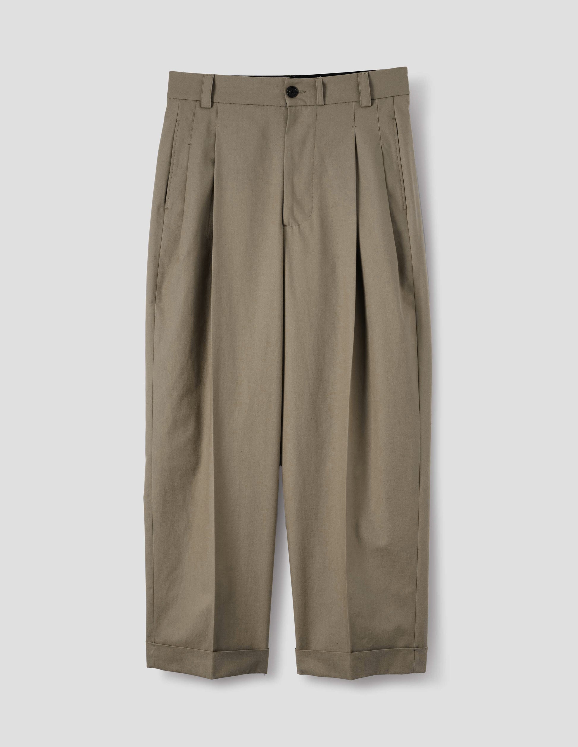 Beige cotton pleated trousers with horn button-through waistband with belt loops, concealed side pockets and cuffed hem. Front flat lay view.