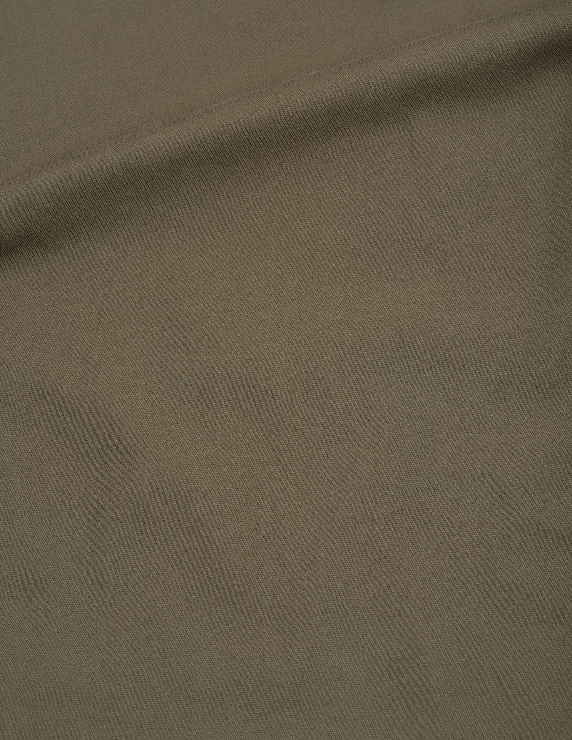 Green yarn dyed cotton twill shirt fabric swatch.