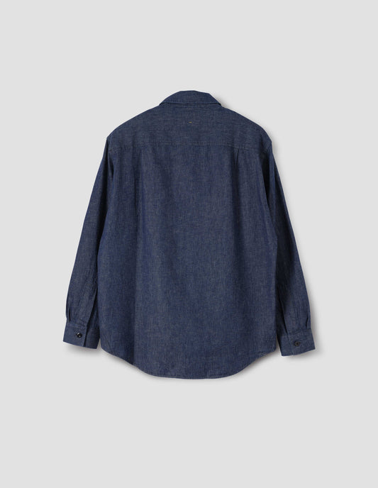 Indigo blue long sleeve shirt with side gusset stitch detailing, corozo button cuffs and box pleats on back yoke. Back flat lay view.