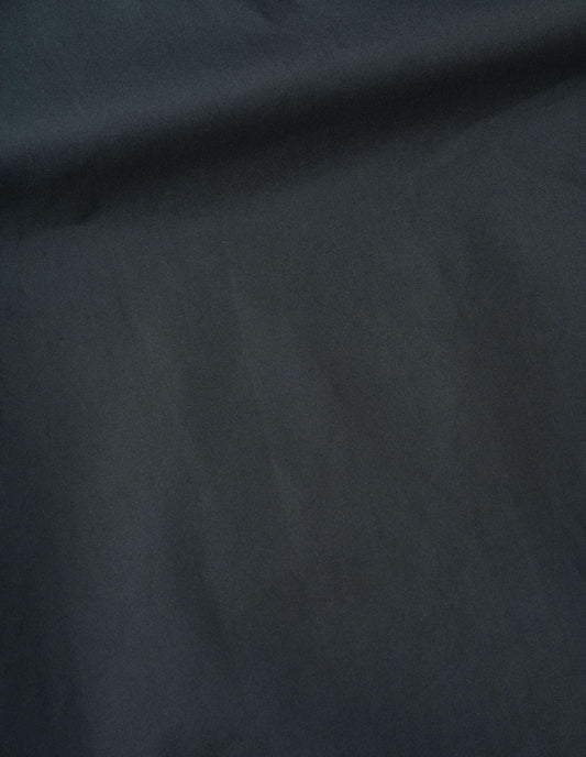 Dark green sleeveless jacket dry cotton canvas fabric swatch.