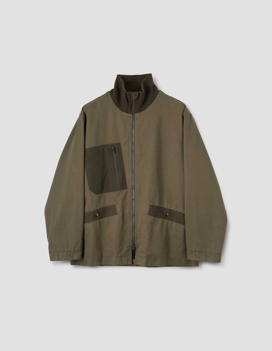 Green jacket with contrast ribbed collar, contrast zip chest pocket and contrast Vislon zip, front flat lay view.