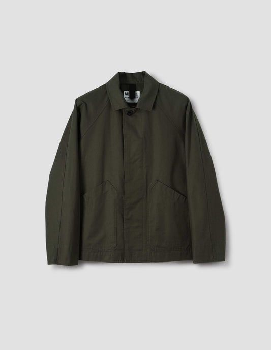 Green raglan sleeve jacket with slant patch pockets and corozo button fastening, front flat lay view.