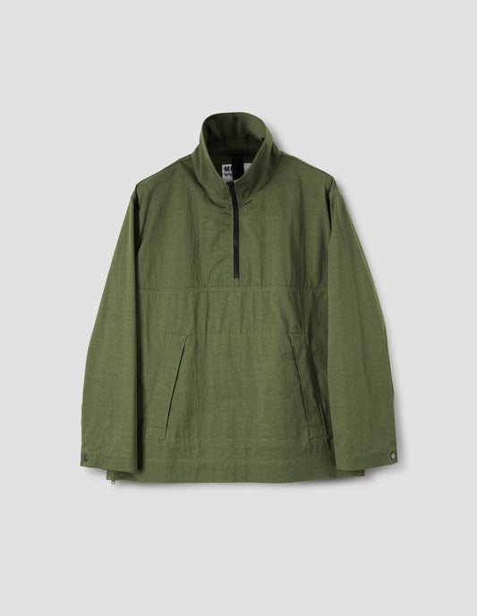 Green anorak with half zip closure, stitch-through flap kangaroo pockets and  popper fastening adjustable cuffs, front flat lay view.