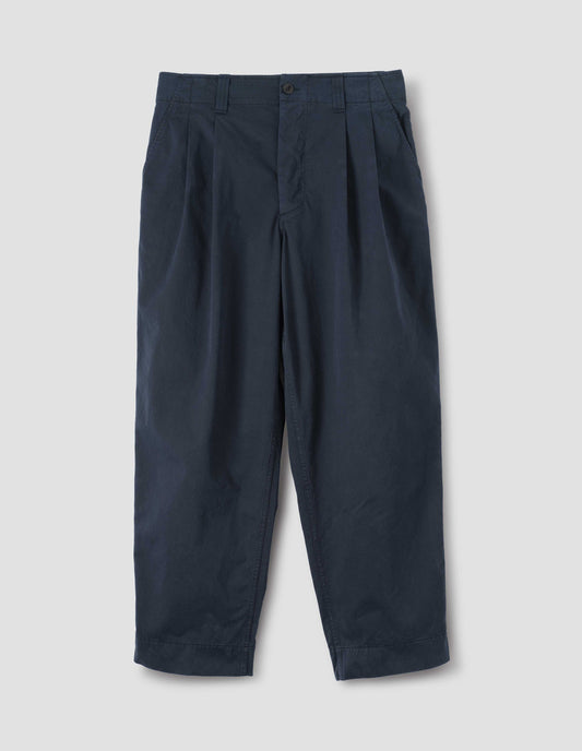 Dark navy double pleated trousers with button fastening and zip fly, belt loops and slant pockets. Front flat lay view.