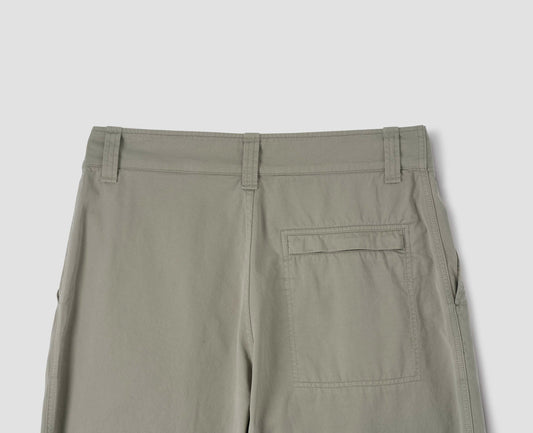 Light green trousers with zip fly back pocket, belt loops and slant pockets. Back flat lay view.