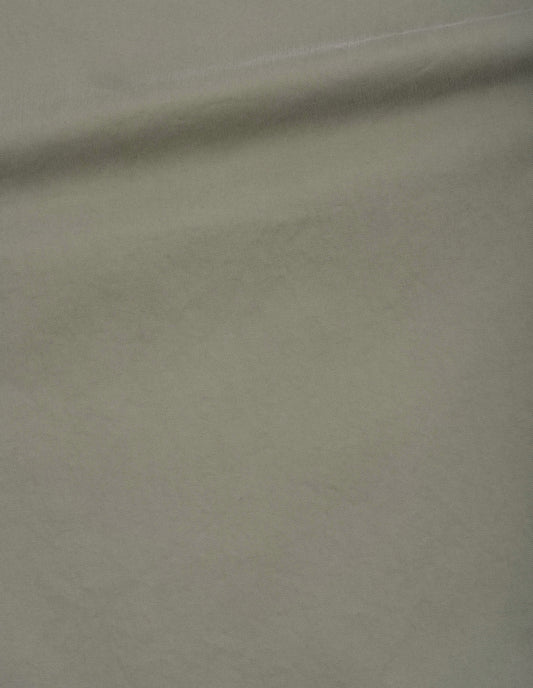 Light green double pleat trousers, tough cotton twill fabric swatch.