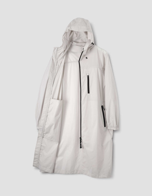 Light grey rain parka with peaked elasticated hood, contrast zip fastening closure and pockets, popper storm flap and elasticated cuffs. Front open flat lay view.
