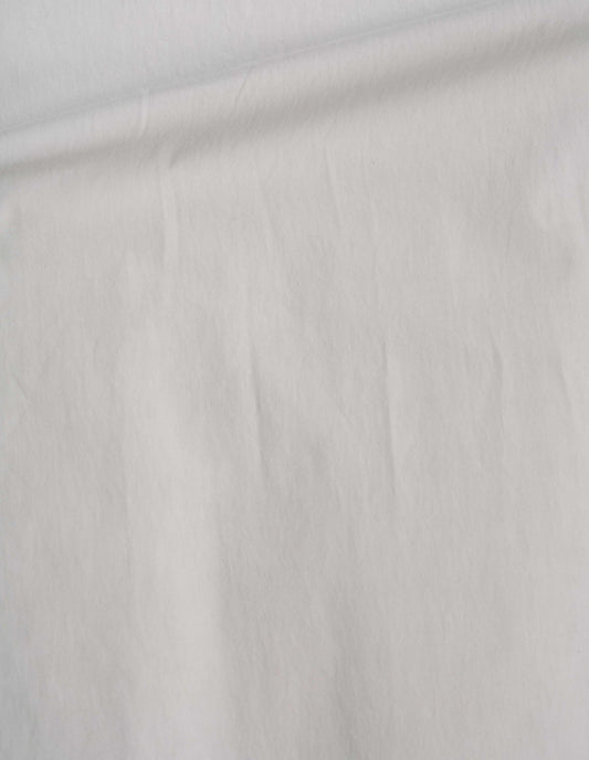Off white trousers, heavy cotton poplin fabric swatch.