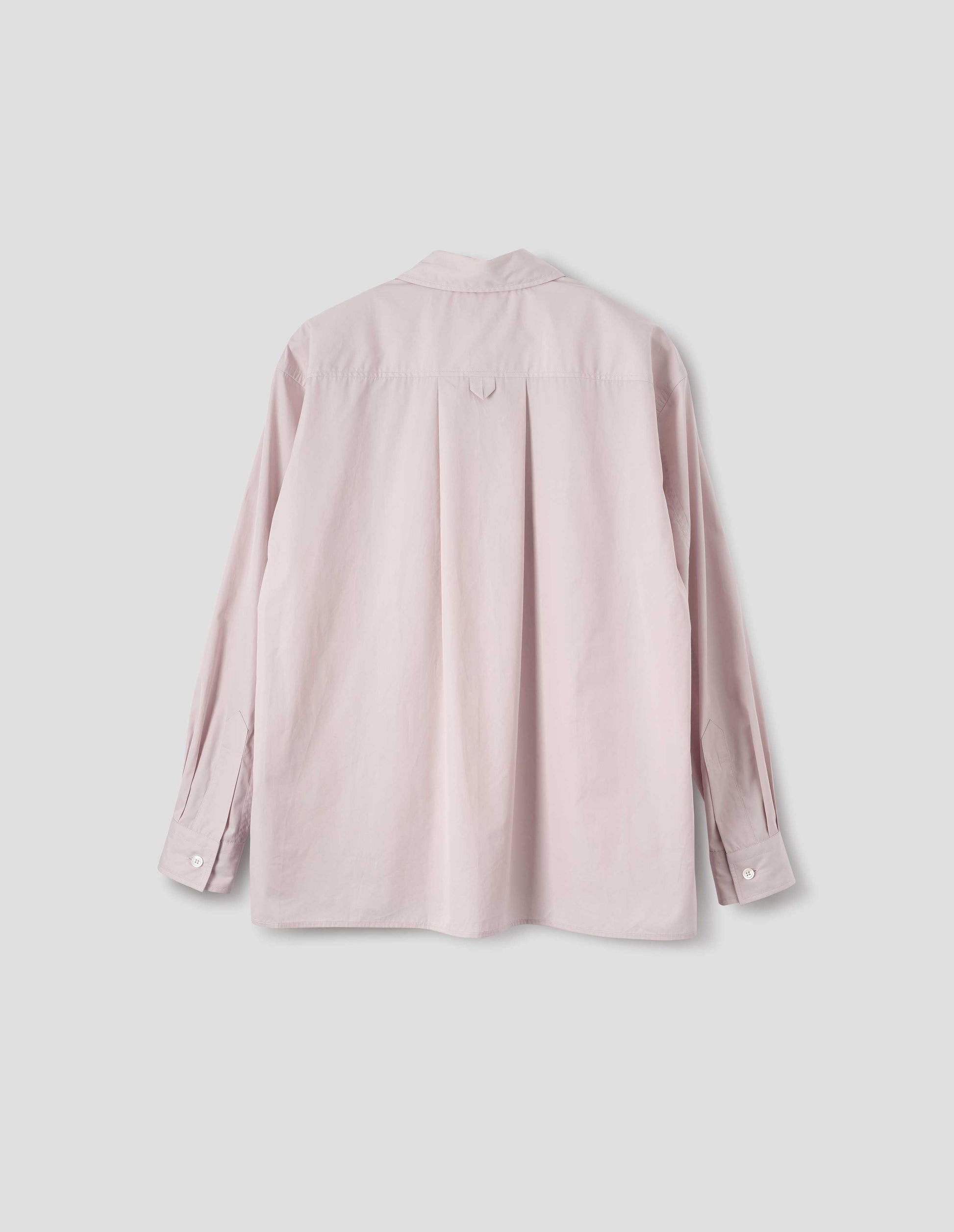 Pink cotton long sleeve shirt with deep side split vents, elongated back and box pleat on back yoke. Back flat lay view.