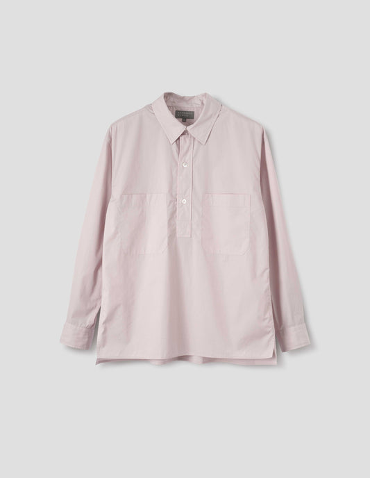 Pink cotton long sleeve shirt with stitch through raised placket, front patch pockets and deep side split vents. Front flat lay view.
