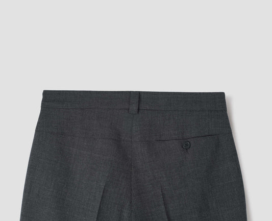 Grey crisp wool trousers, with horn button fastening concealed pocket and belt loop. Back flat lay view. 